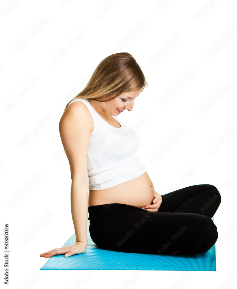 Fototapeta premium Pregnant woman fitness isolated on white