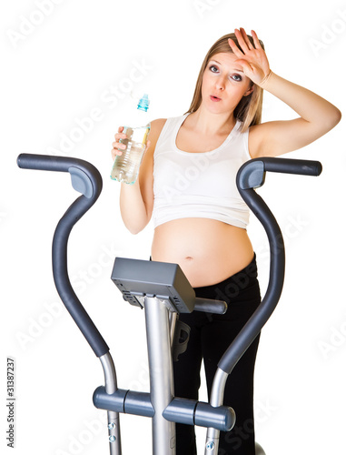 Pregnant woman fitness isolated on white