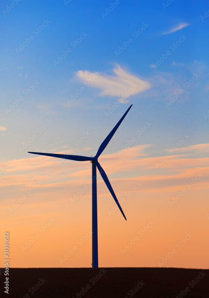 Silhouette of wind turbines against the sunset sky.. Silhouette of wind turbines against the sunset sky..