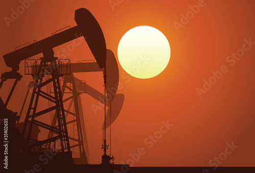Silhouette of three oil rigs