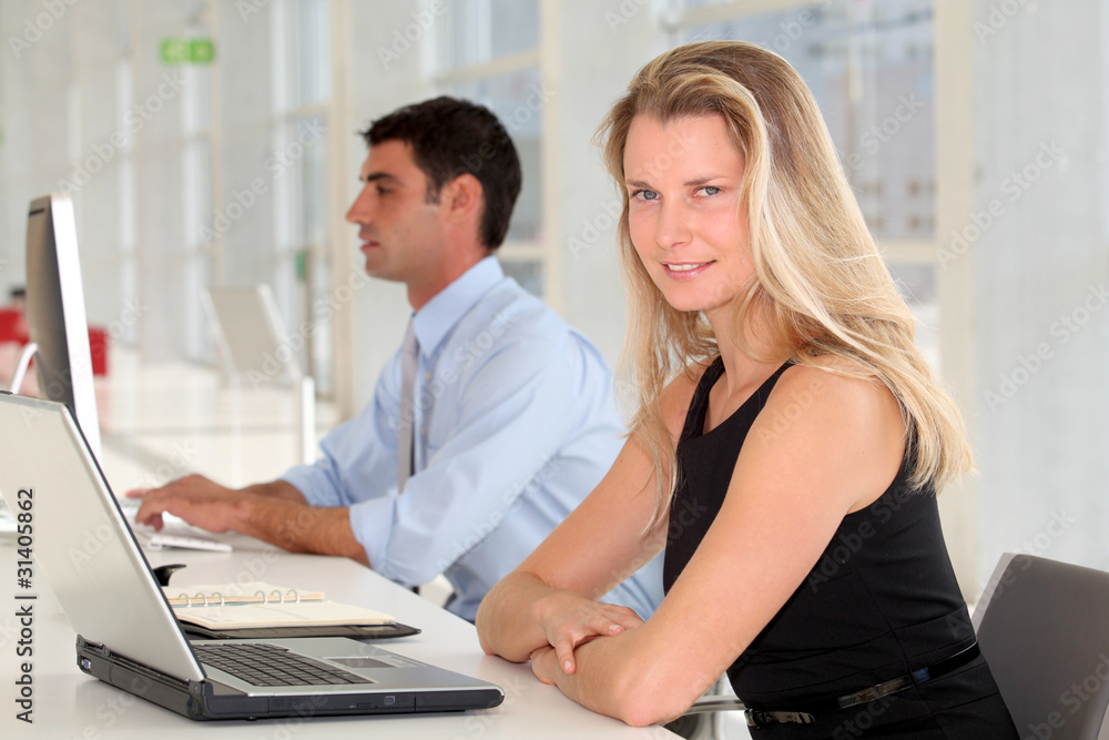 Businesswoman in front of laptop computer Businesswoman in front of laptop computer