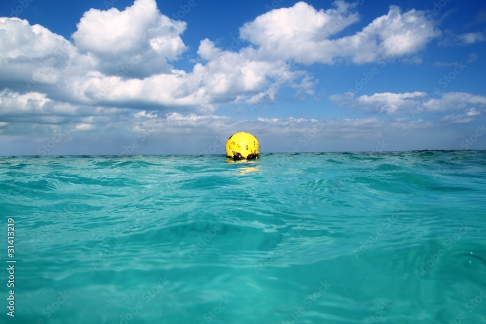 Obraz premium Buoy yellow floating in tropical Caribbean sea