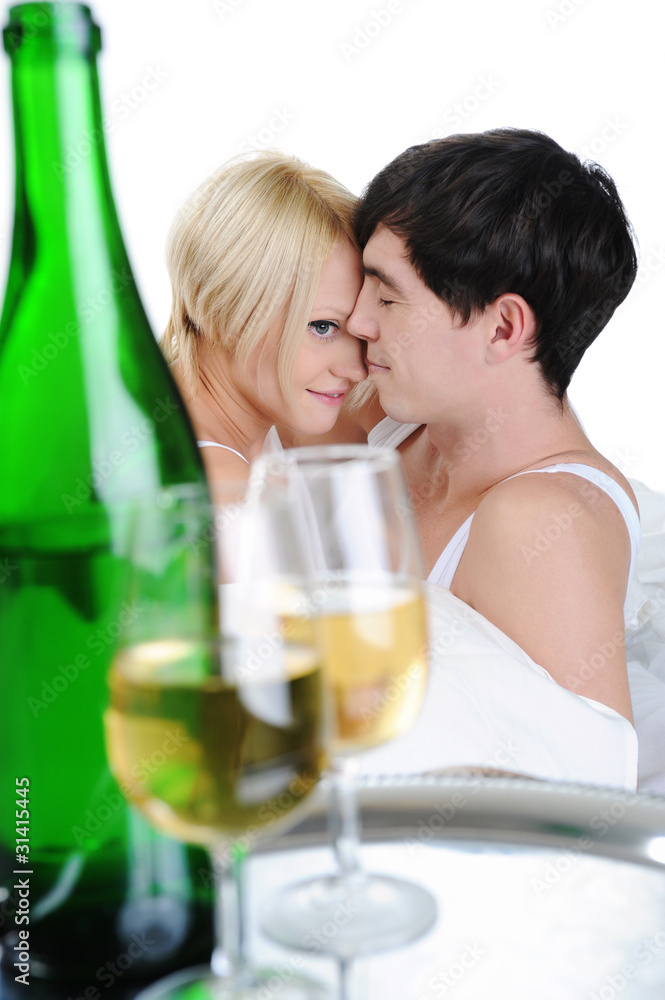 Young couple drinking champagne in bed Young couple drinking champagne in bed