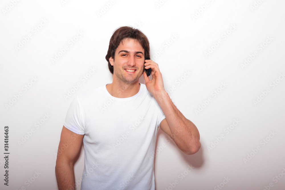 young casual man talking on the phone young casual man talking on the phone