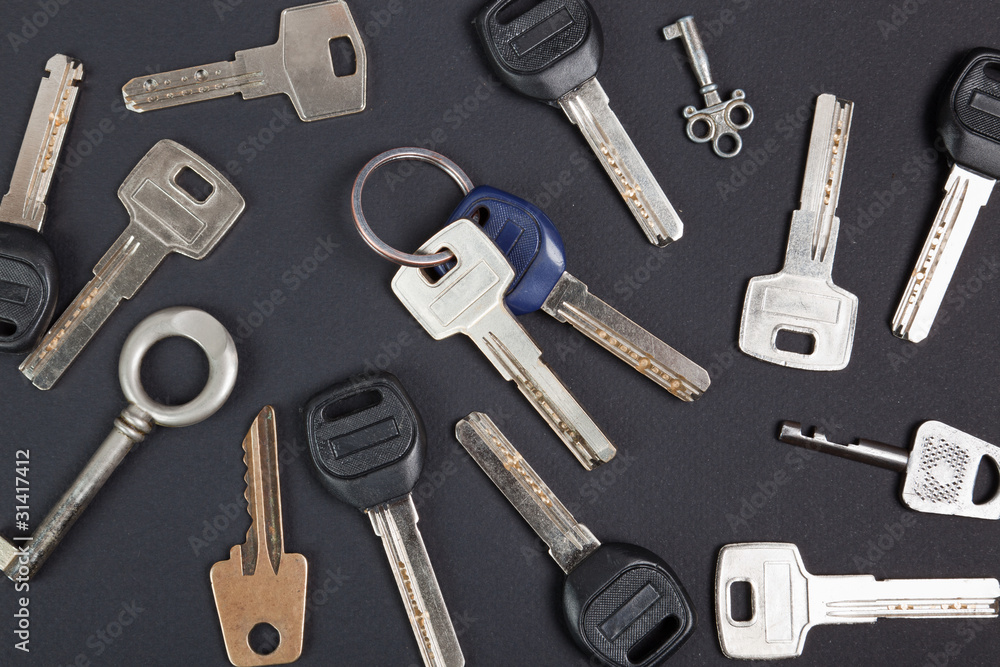 Fototapeta premium keys collection on black background