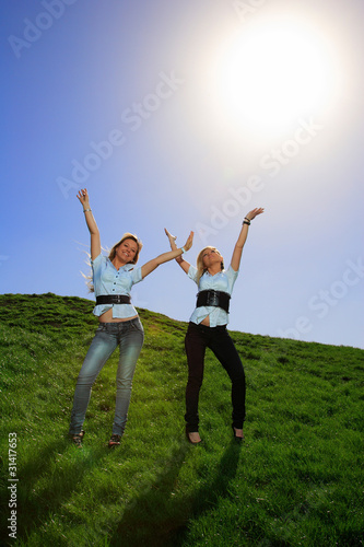 Two beautiful girl on the hill