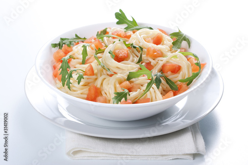Pasta with tomato and rucola