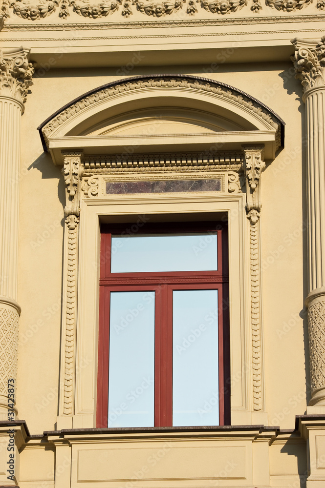 Obraz premium New window in old ornamented house