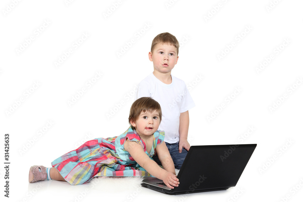 brother and the sister look cartoon films on a laptop brother and the sister look cartoon films on a laptop
