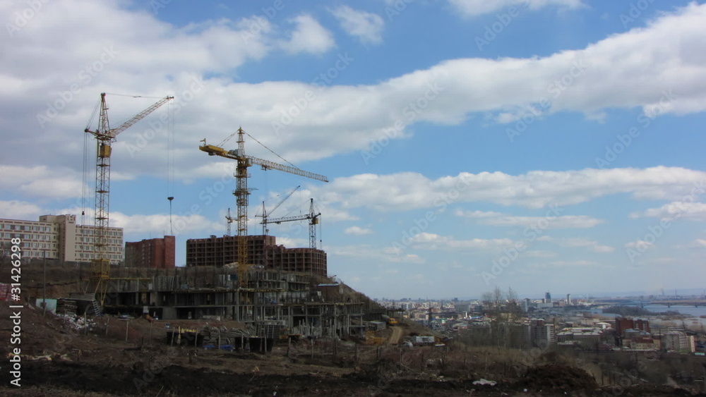 time lapse of cranes on a building sites. time lapse of cranes on a building sites.