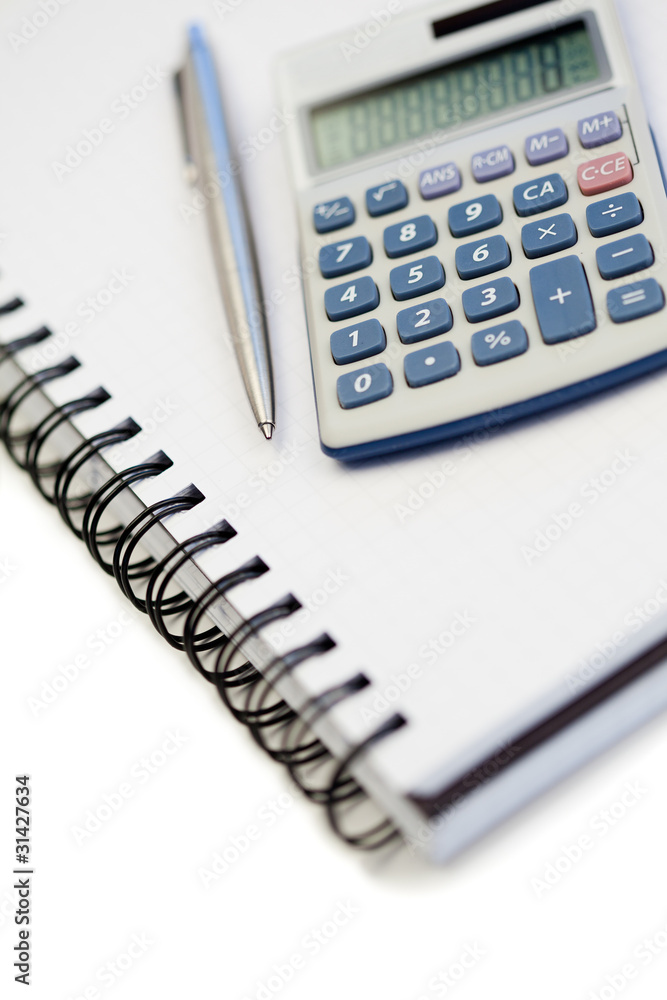 Angled notebook with pencil and pocket calculator Angled notebook with pencil and pocket calculator