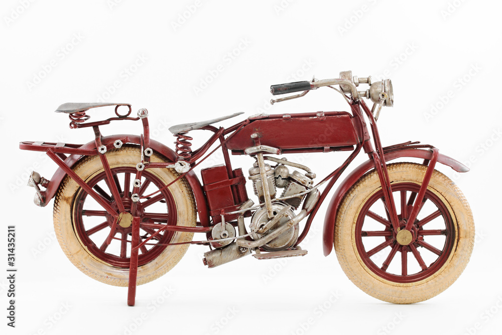 Fototapeta premium Handmade tin 1930's vintage motorcycle model, isolated