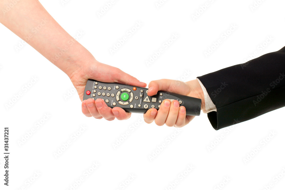 adult and boy hands struggle for remote control isolated adult and boy hands struggle for remote control isolated