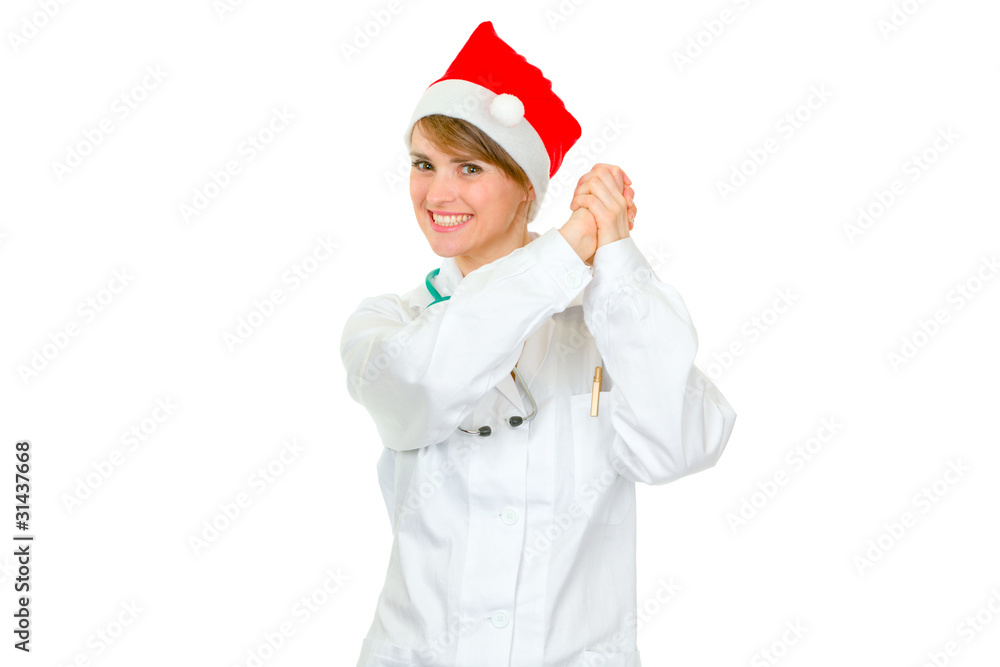 Smiling female medical doctor in Santa hat showing partnership Smiling female medical doctor in Santa hat showing partnership