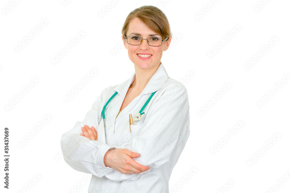 Smiling female medical doctor holding crossed arms on chest Smiling female medical doctor holding crossed arms on chest