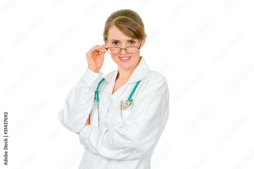 Smiling medical doctor woman with glasses looking at you Smiling medical doctor woman with glasses looking at you