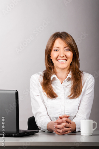 woman at office with laptop