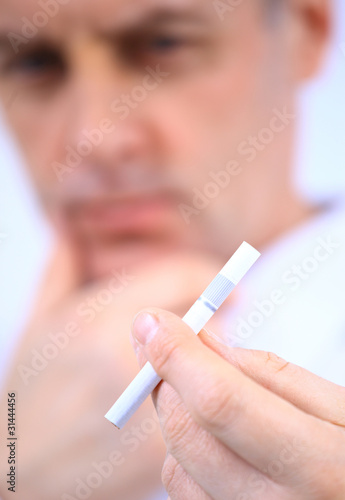 man holding cigarette