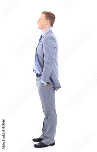 Full length of a handsome business man with hands