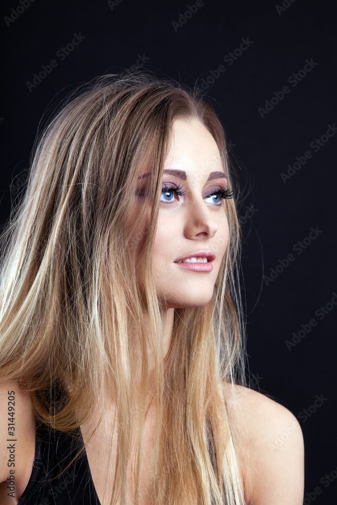 Naklejka premium Young amazing blond girl look at light