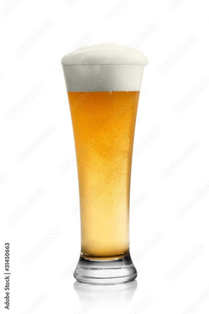 Beer into glass isolated on white Beer into glass isolated on white