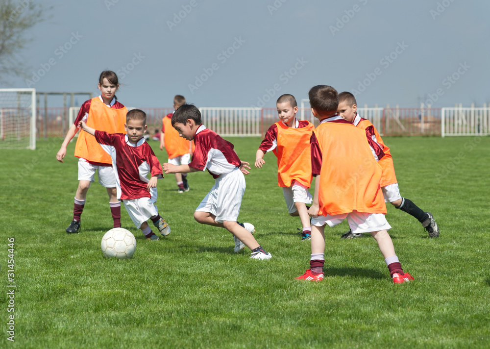 children playing soccer