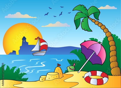 Beach with umbrella and sand castle