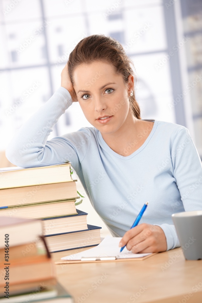 Happy student learning at home smiling Happy student learning at home smiling