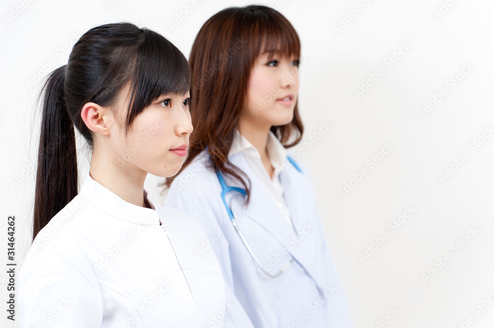 two beautiful asian doctors looking two beautiful asian doctors looking