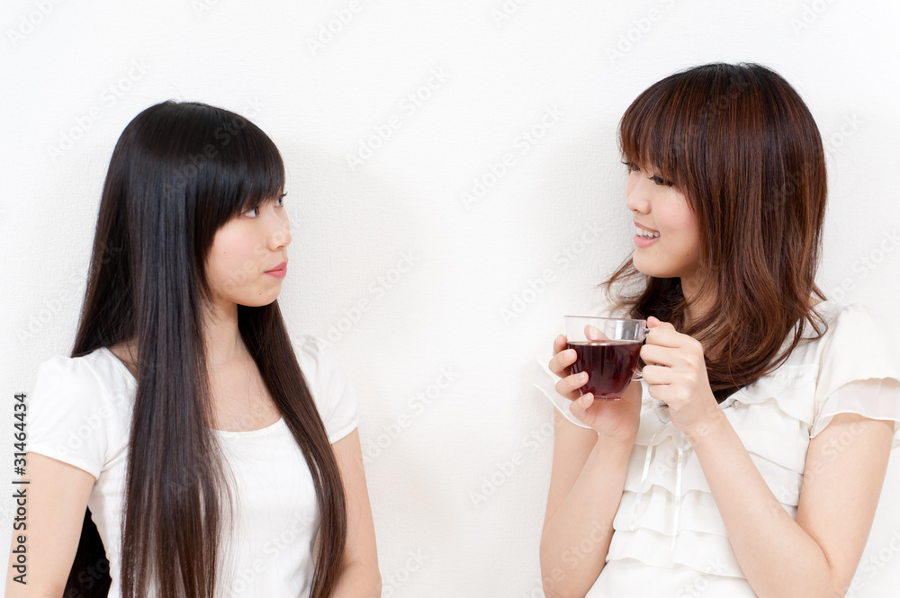 two beautiful asian women relaxing two beautiful asian women relaxing