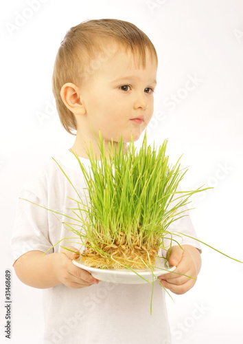 little boy with green grass