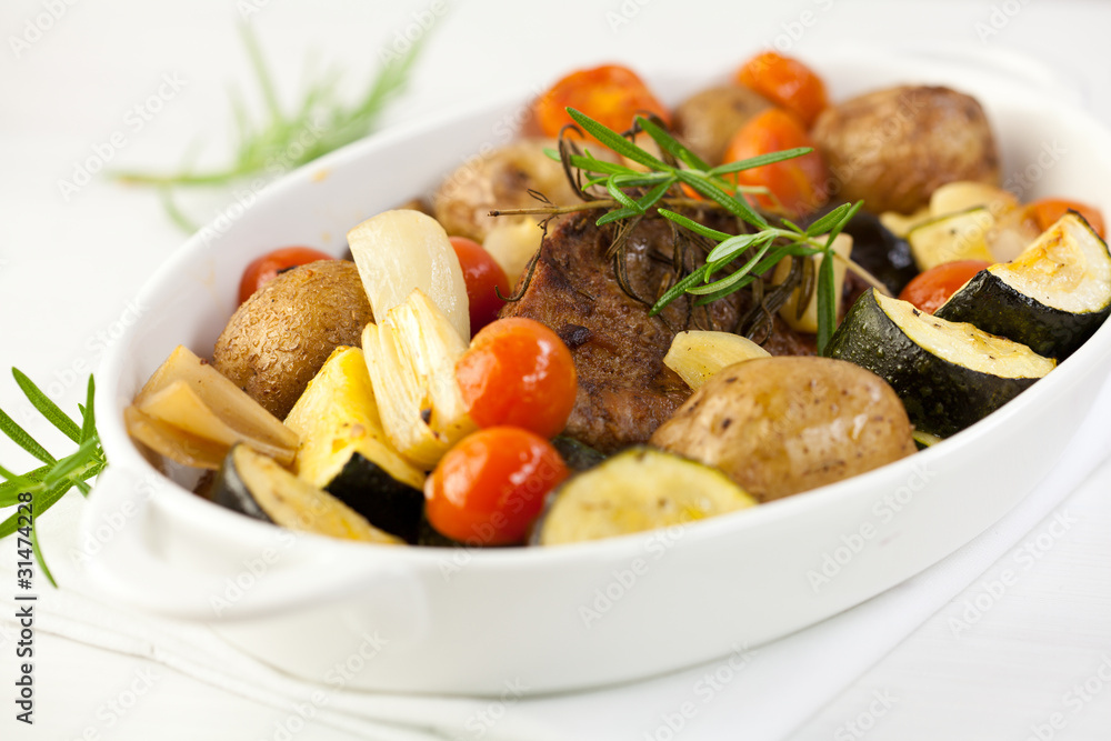 Rustic roast pork with baked vegetables and rosemary Rustic roast pork with baked vegetables and rosemary