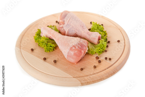 Fresh raw chicken legs isolated on white background