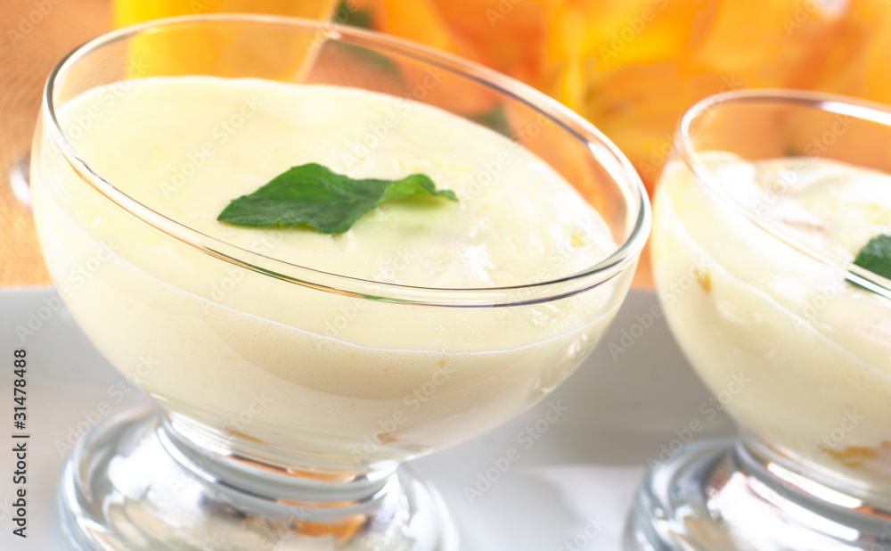 Cream cheese dessert garnished with mint leaf Cream cheese dessert garnished with mint leaf