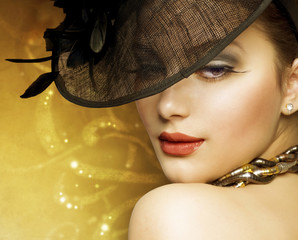 Beautiful Woman over luxury gold background