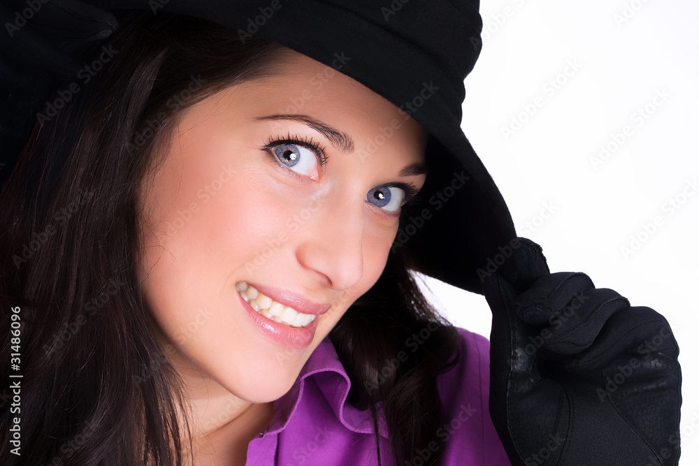 Portrait of a beautiful young woman with gloves and black hat Portrait of a beautiful young woman with gloves and black hat