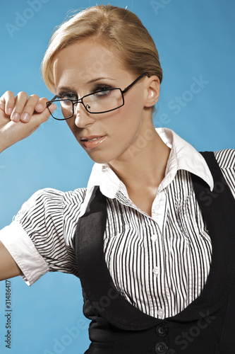 Businness woman portrait, holding a glasses. photo