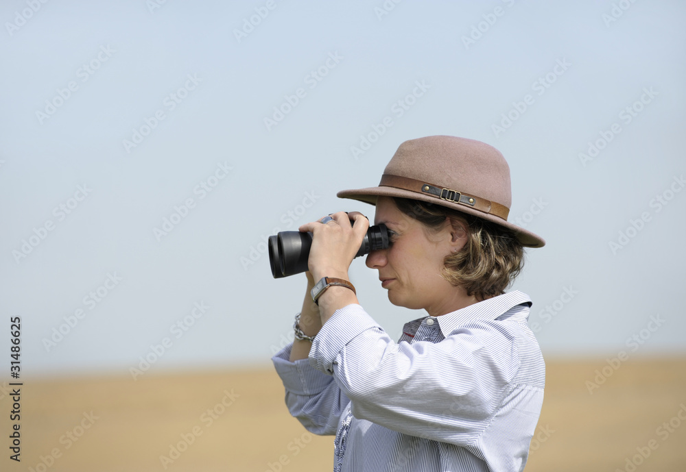 woman with binoculars outdoors woman with binoculars outdoors