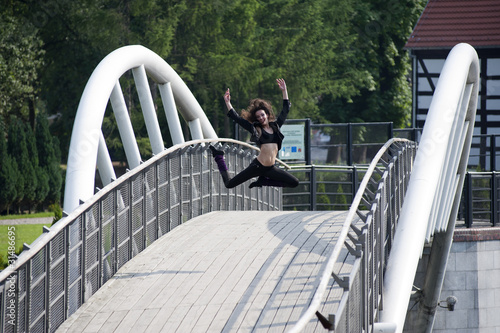 jumping dancer on bridge