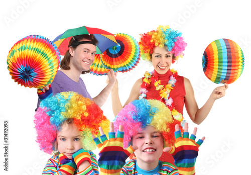 family with rainbow hat umbrella on head and colorfull ball