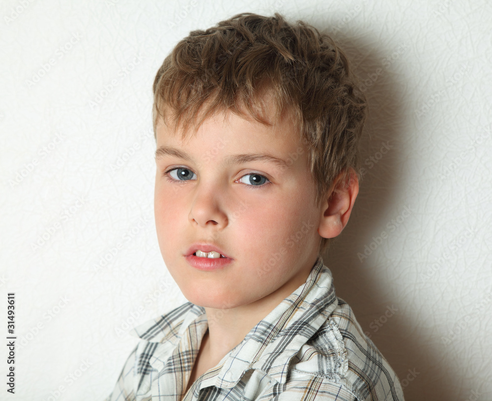 Portrait of thoughtful young blonde boy in chequered shirt Portrait of thoughtful young blonde boy in chequered shirt