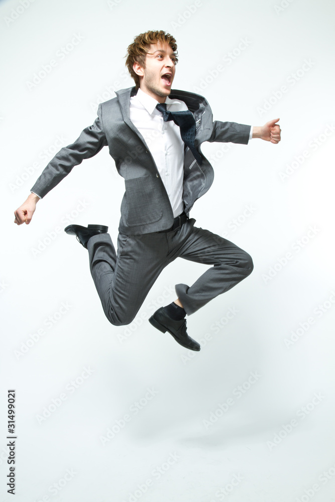 young businessman jumping