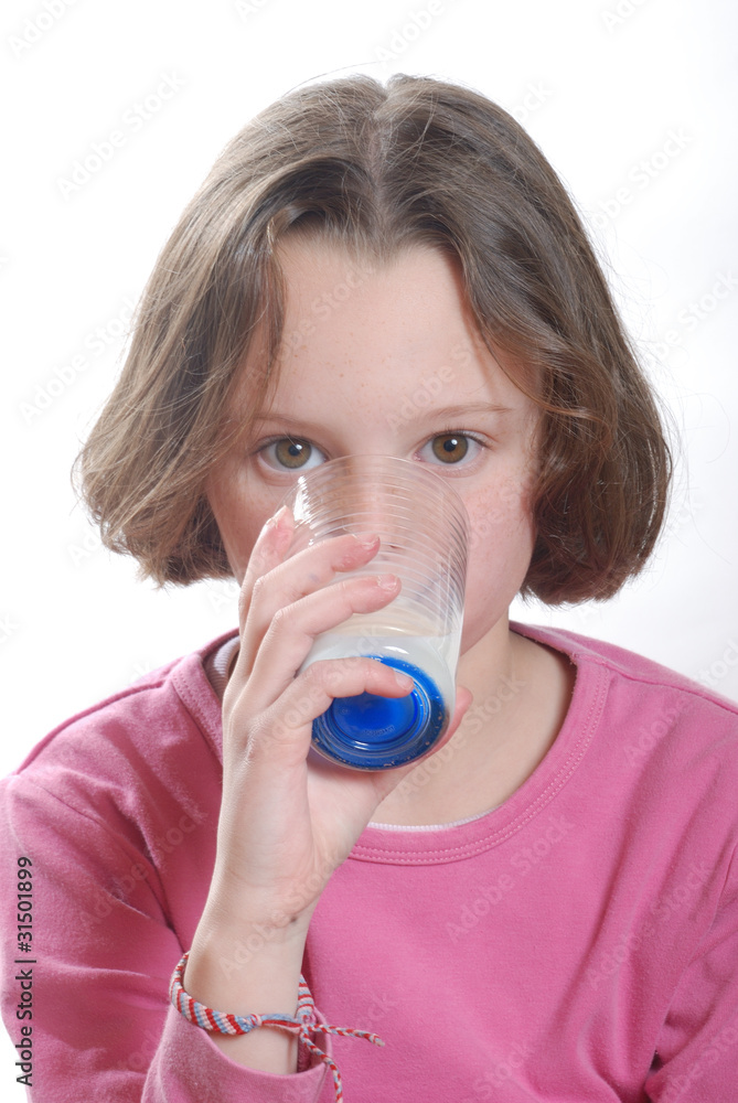 Portrait of a girl drinking a glass of milk Portrait of a girl drinking a glass of milk