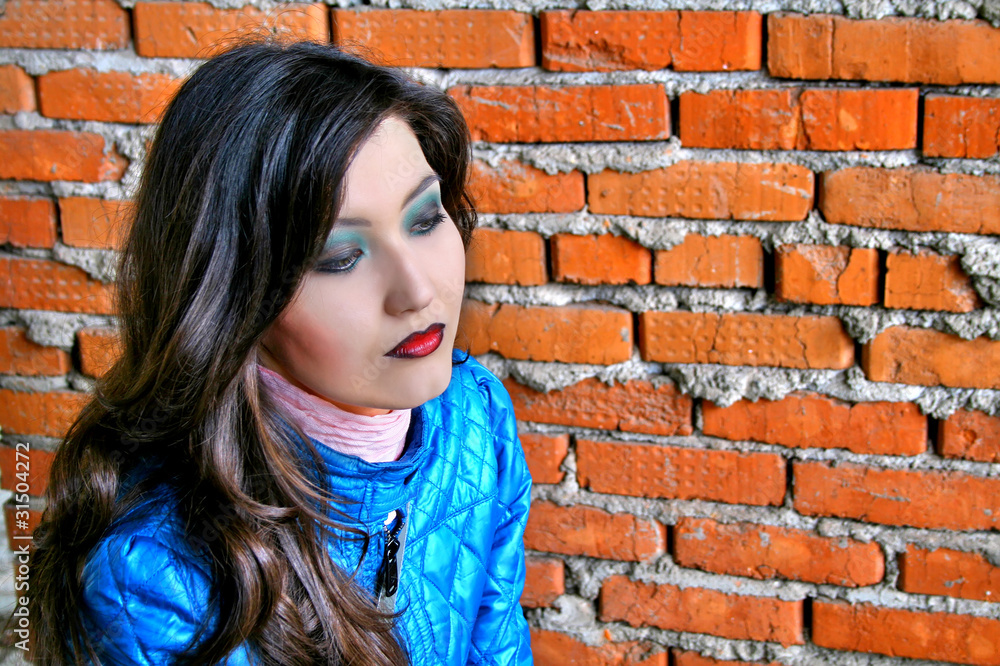 Girl near a brick wall Girl near a brick wall