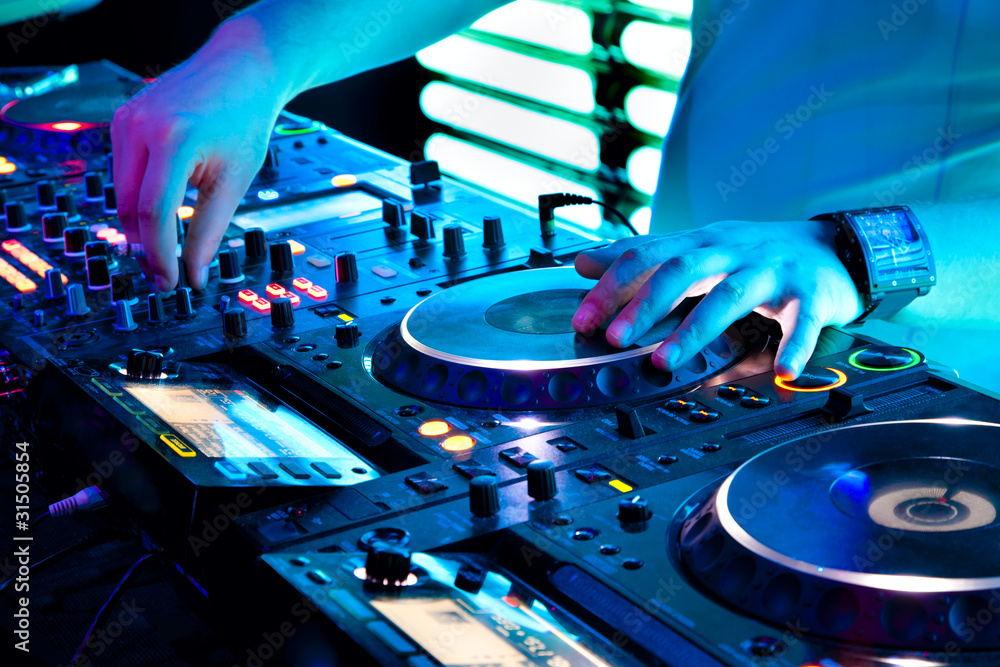 Obraz premium Dj mixes the track