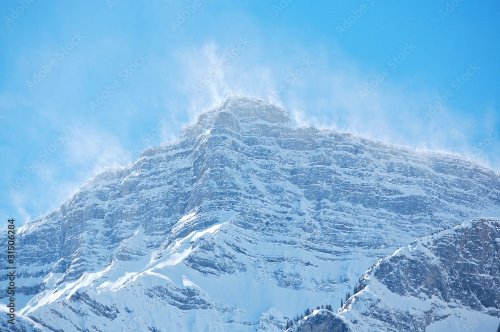 Snow spindrift on mountain peak 05