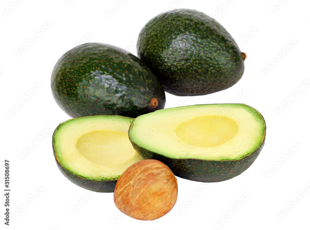 Avocados on white, cut and whole with pit. Avocados on white, cut and whole with pit.
