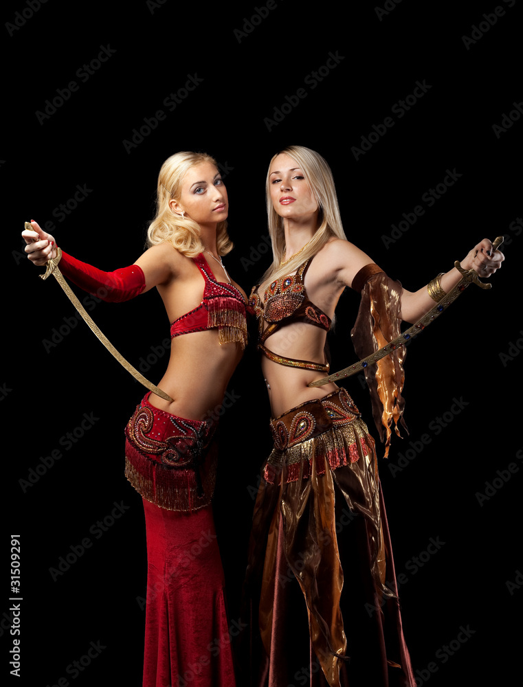 Two blond beauty girl stand with saber Two blond beauty girl stand with saber