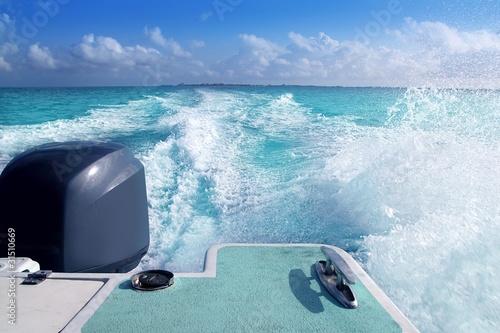 boat outboard stern with prop wash caribbean foam photo