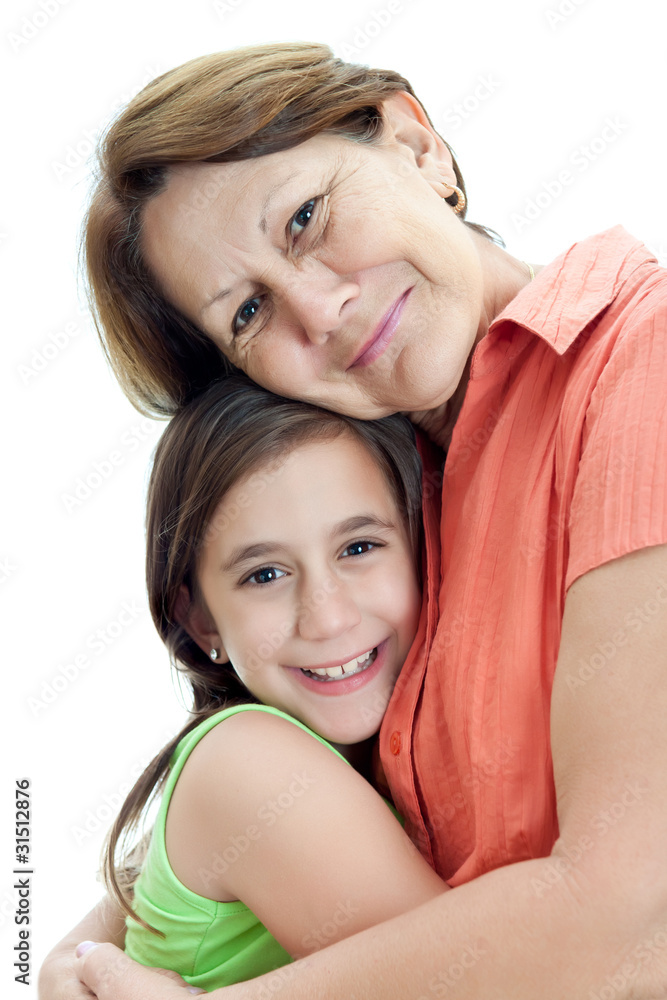 Latin girl hugging her grandmother isolated on a white backgroun Latin girl hugging her grandmother isolated on a white backgroun